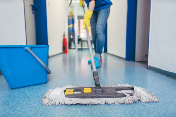 Professional cleaner mopping a residential floor, ensuring a spotless and hygienic finish.