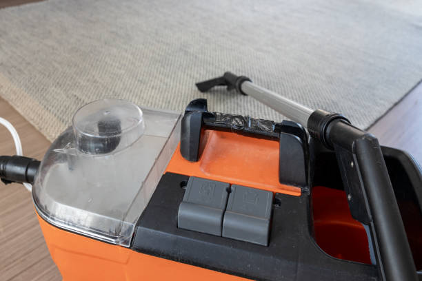 Carpet and rug cleaner with nozzle in a living room