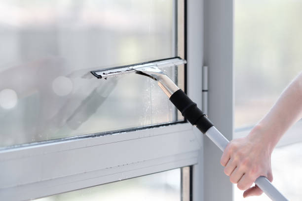 Cleaner delivers window cleaning with squeegee.