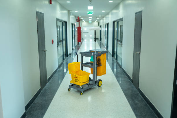 Yellow cleaning trolley positioned in a luxurious hotel