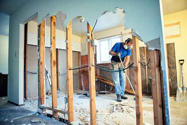 A janitor employing machinery for standard cleaning activities.