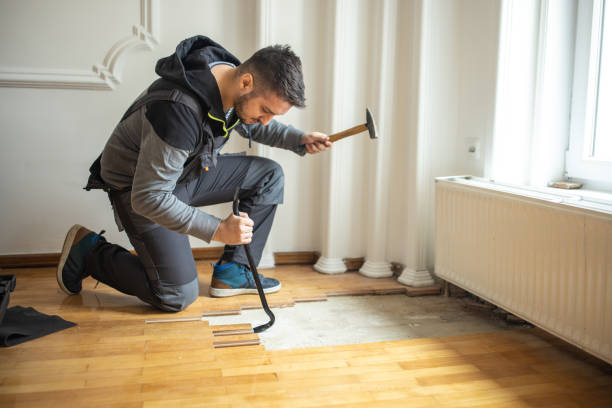 Expert worker delivering floor stripping services.