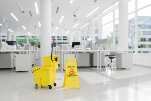 Cleaners using a professional tools to create a spotless, hygienic workspace.