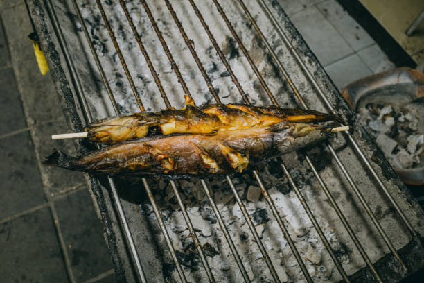 Grilled fish served on a plate, showcasing a deliciously cooked meal, perfect for enjoying after a thorough oven clean.