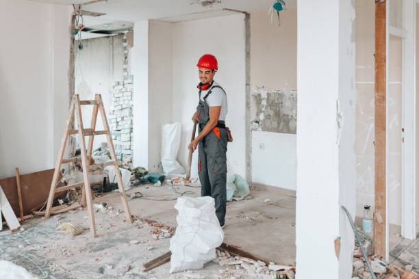 A detail-oriented construction worker renewing the apartment's overall ambiance.