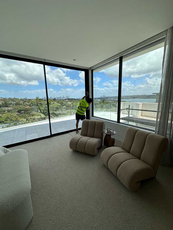 Cleaner perform window cleaning services with best cleaning tool.