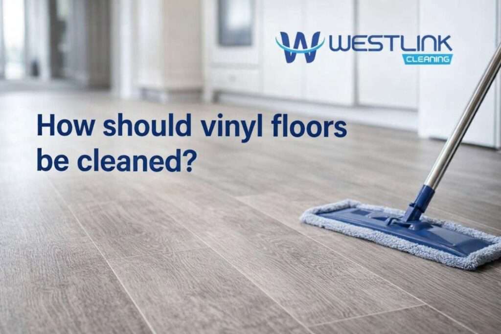 Realistic vinyl floor being cleaned carefully with a microfiber mop in a premium modern interior.