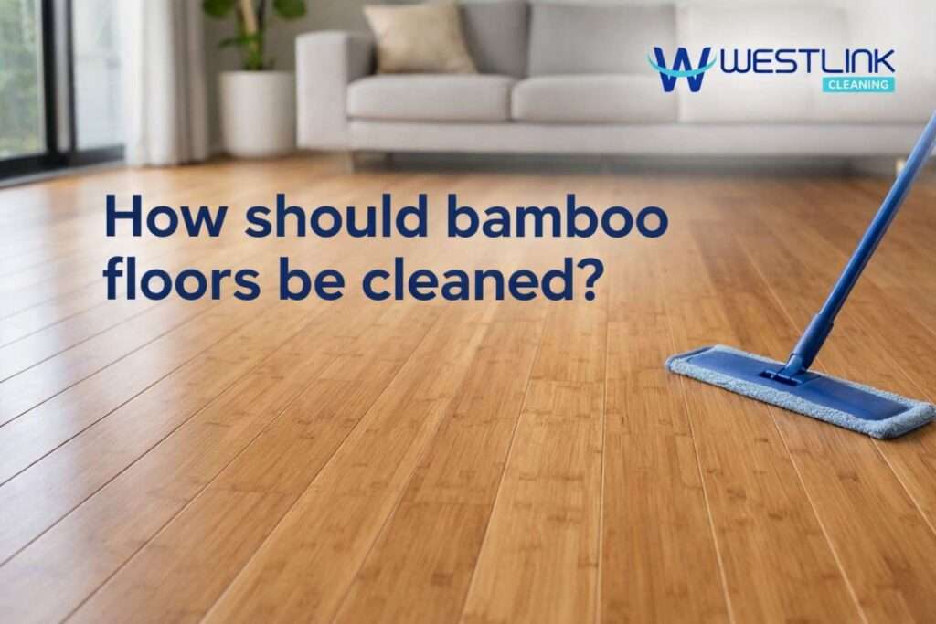 Realistic bamboo floor being cleaned carefully with a microfiber mop in a premium modern interior.