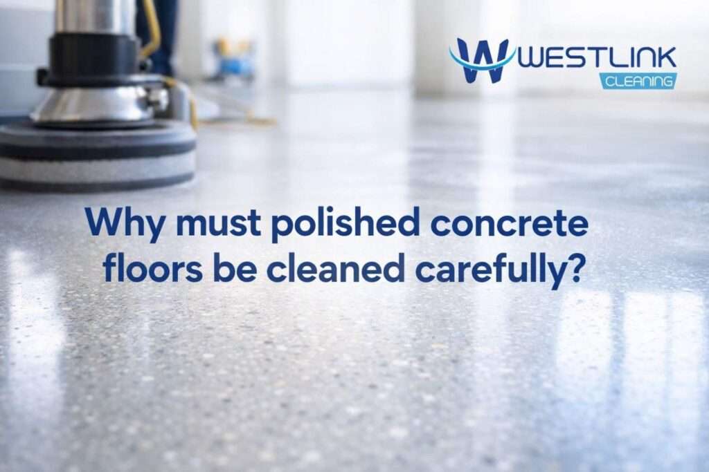 Fine dust and tracked grit on a polished concrete floor in a modern indoor space showing how dirt can reduce shine and increase wear