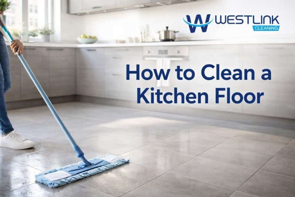 A person cleaning a modern kitchen floor with a microfiber mop in a bright, realistic home kitchen.