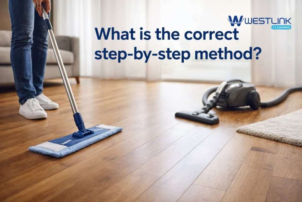 Person using the correct step-by-step method to clean a polished timber floor with a microfiber mop