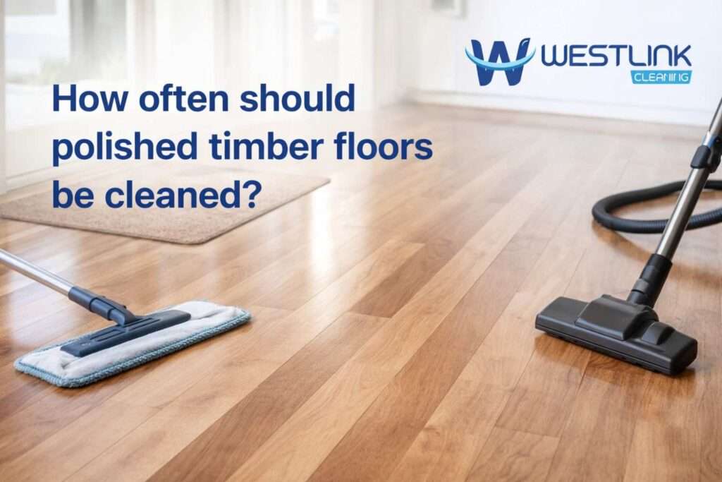 Polished timber floor in a modern home with cleaning tools for regular routine maintenance
