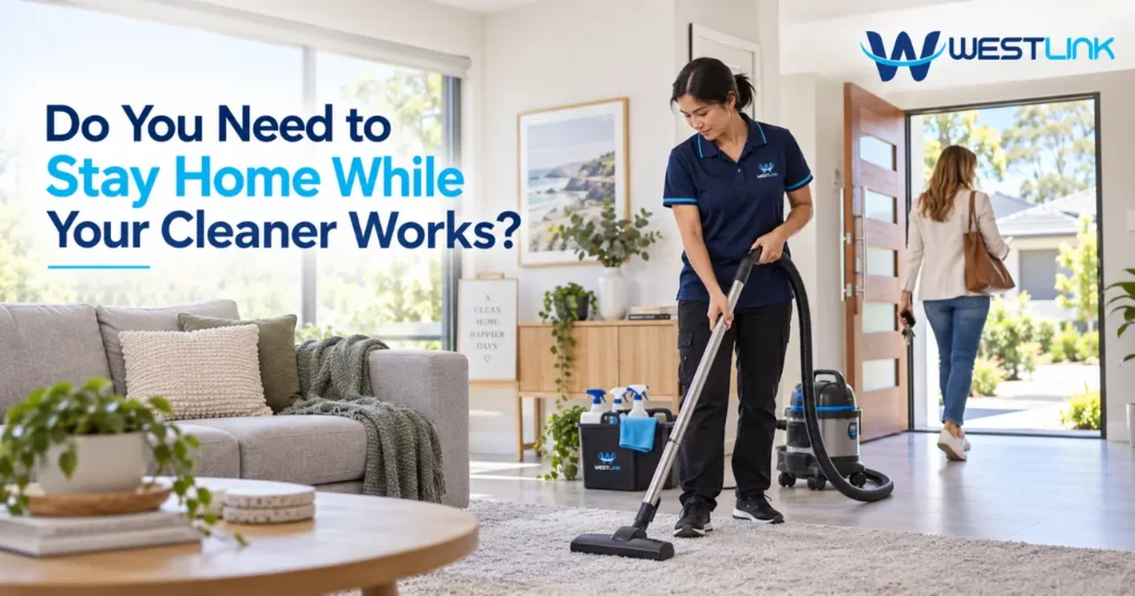 Homeowner working while cleaner cleans