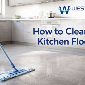 A person cleaning a modern kitchen floor with a microfiber mop in a bright, realistic home kitchen.