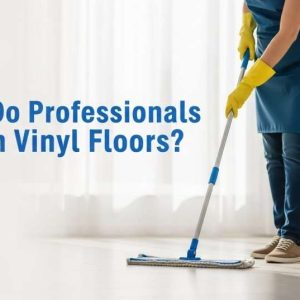 Professional cleaner using a microfiber mop on vinyl flooring in a bright modern home.