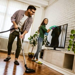 couple cleaning their home